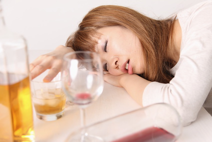 二日酔いの女性